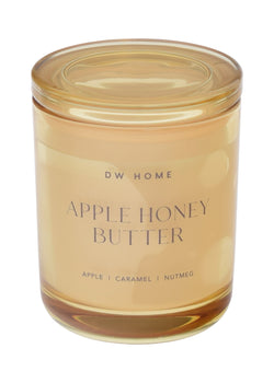 Glass candle jar labeled 'Apple Honey Butter' by DW Home