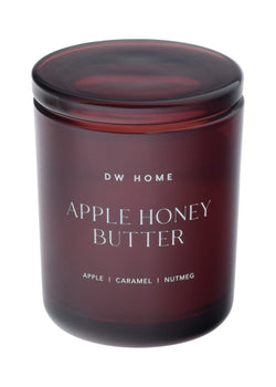 Dark red DW Home candle labeled 'Apple Honey Butter'