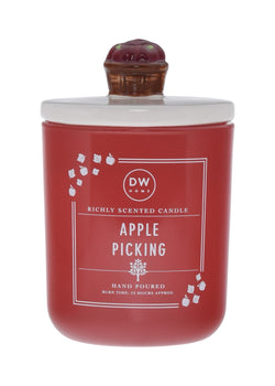 Red candle labeled 'Apple Picking' with a decorative lid with an apple basket