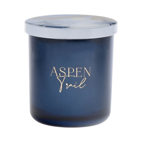 Dark blue Aspen Trail candle with metallic gold print.