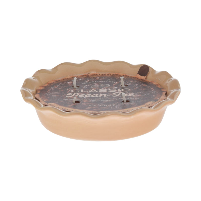 Pie-shaped candle with 'Pecan Pie' text on a white background