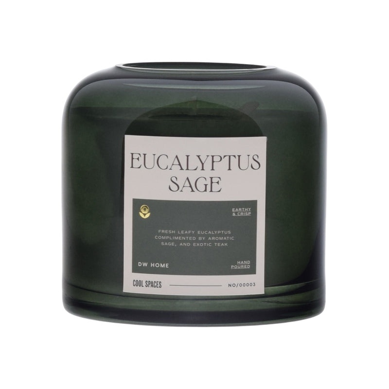 Green candle with a label on a white background