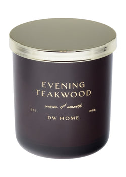 Dark purple candle with gold lid labeled 'Evening Teakwood' by DW Home