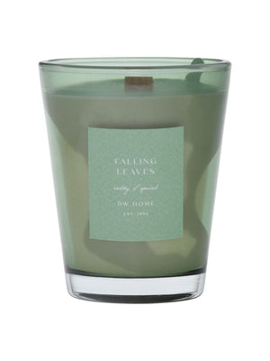 Green vase candle with a label on a green background