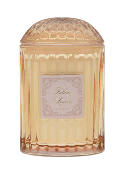 Decorative cream jar with a textured lid on a cream background