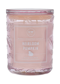 Candle jar labeled 'Heirloom Pumpkin' with a decorative design on a white background