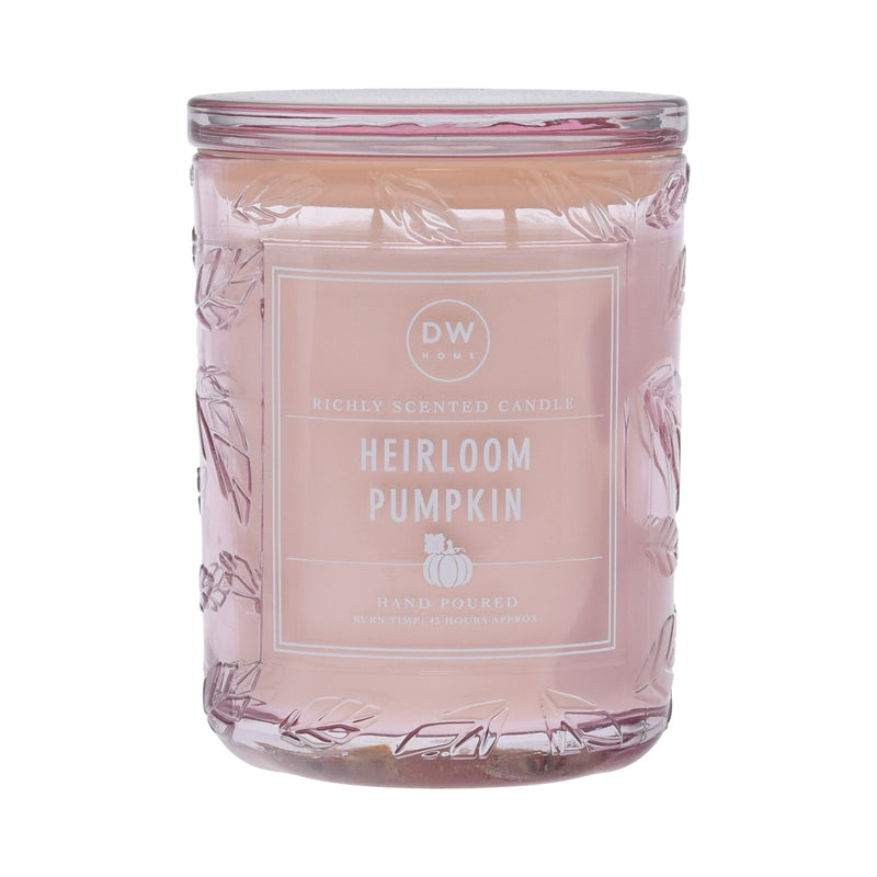 Candle jar labeled 'Heirloom Pumpkin' with a decorative design on a white background