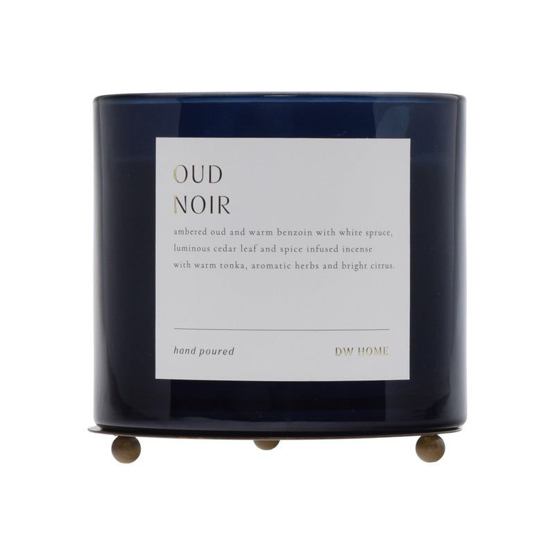 Dark blue candle with a label on a white background