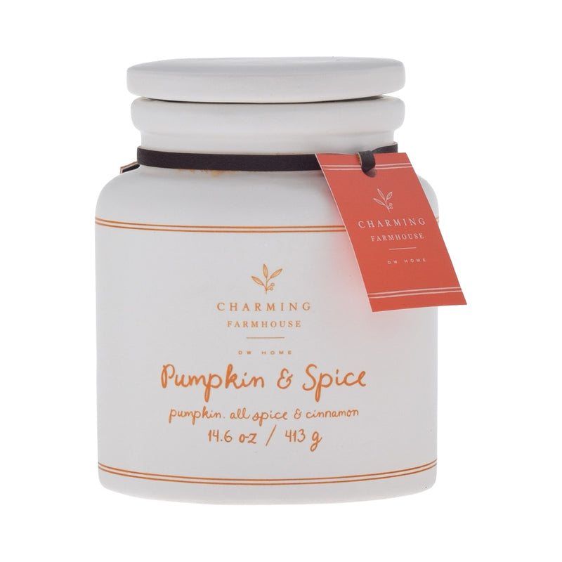 White candle jar with 'Pumpkin & Spice' label and Charming Farmhouse tag on a white background