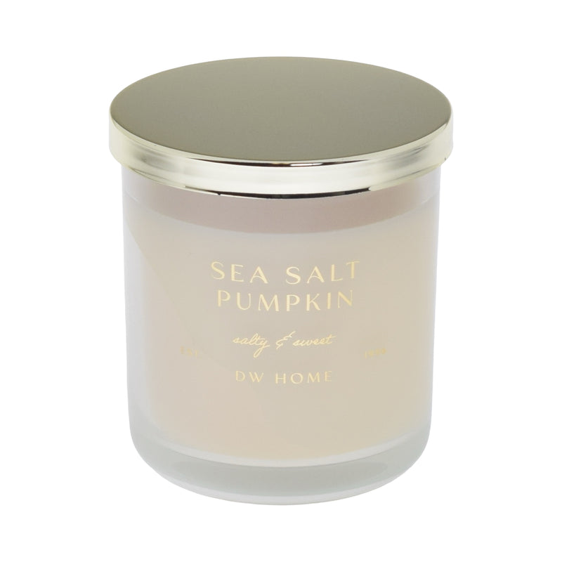 Candle with 'Sea Salt Pumpkin' and 'DW Home' text on a white background