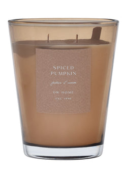 Brown vase candle in a glass container with a label on a brown background