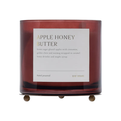 Candle with 'Apple Honey Butter' label on a white background