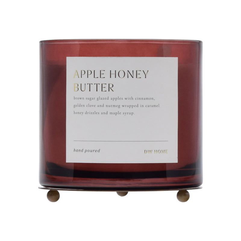 Candle with 'Apple Honey Butter' label on a white background