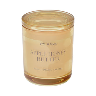 Glass candle jar labeled 'Apple Honey Butter' by DW Home