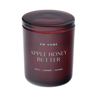 Dark red DW Home candle labeled 'Apple Honey Butter'