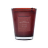 Red candle with a label on a red background