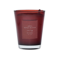Red candle with a label on a red background