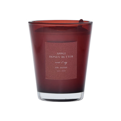 Red candle with a label on a red background