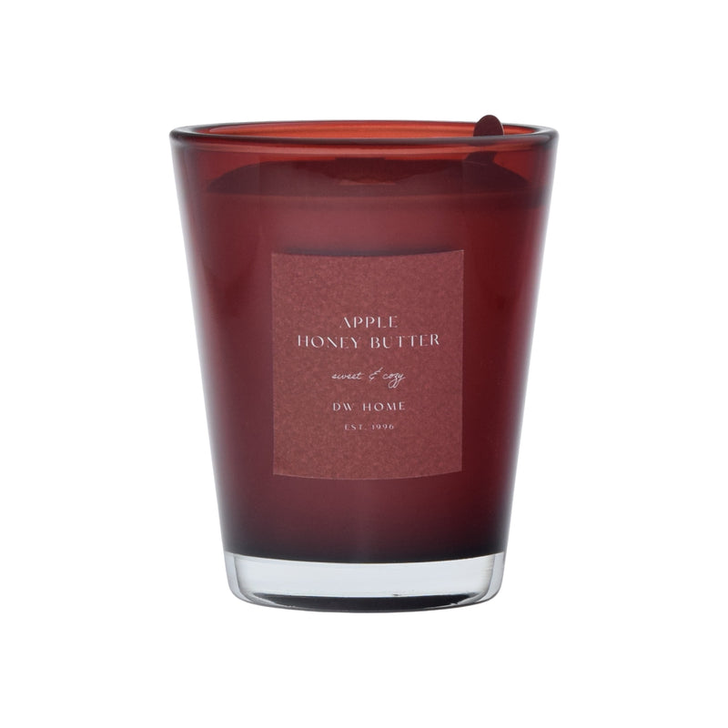 Red candle with a label on a red background