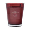 Red candle with a label on a red background