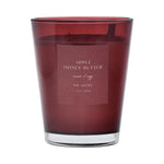 Red candle with a label on a red background
