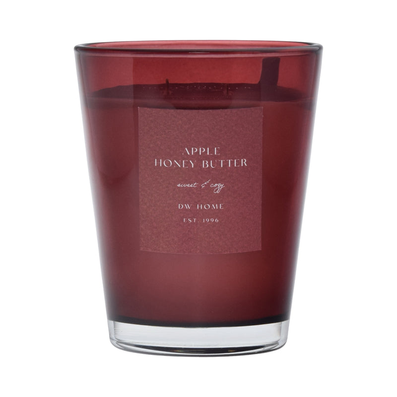 Red candle with a label on a red background