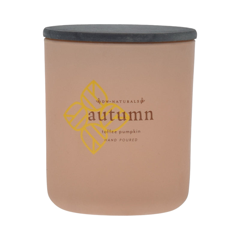 Tan candle jar with 'autumn' and 'toffee pumpkin' text on a tan background