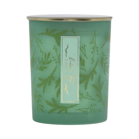 Green balsam fir candle with gold lid and green foliage print design