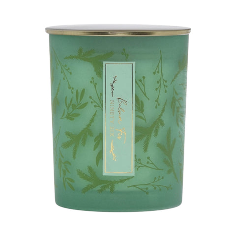 Green balsam fir candle with gold lid and green foliage print design