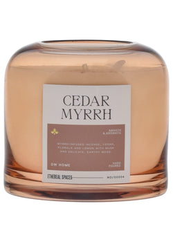 Candle labeled 'Cedar Myrrh' with a label on a white background