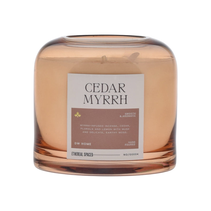 Candle labeled 'Cedar Myrrh' with a label on a white background