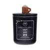 Black candle labeled 'Cozy Cafe' with a brown mug on top of the lid