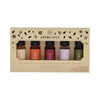 Set of five aroma oil bottles in a decorative box with DW Aroma Oils branding.