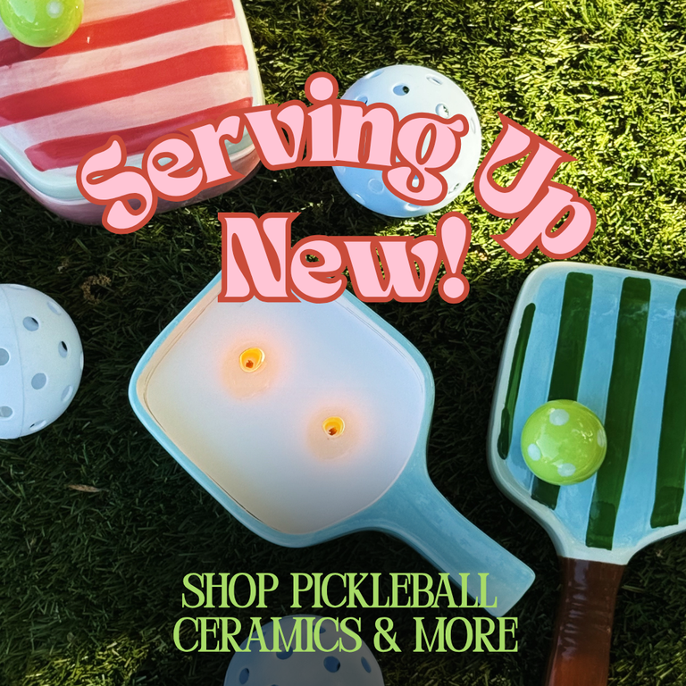 New Pickleball-themed ceramics on a grass background. Shop pickleball ceramics and more