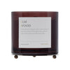 Candle with 'Elm Wood' label on a white background