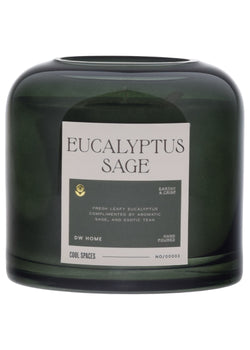 Green candle with a label on a white background