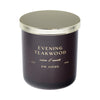Dark purple candle with gold lid labeled 'Evening Teakwood' by DW Home