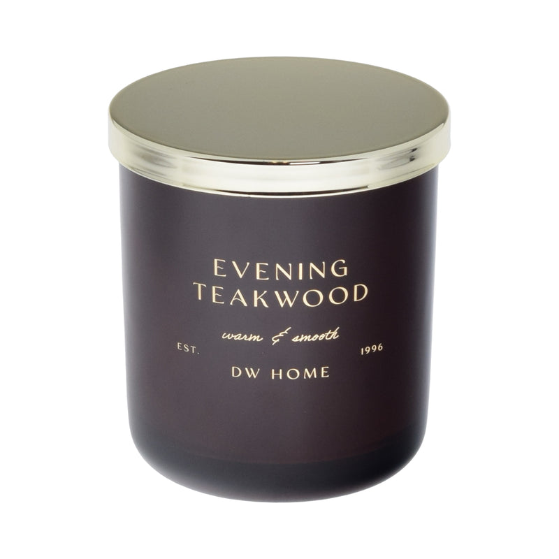 Dark purple candle with gold lid labeled 'Evening Teakwood' by DW Home