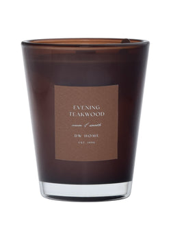 Brown DW Home candle with label on a brown background
