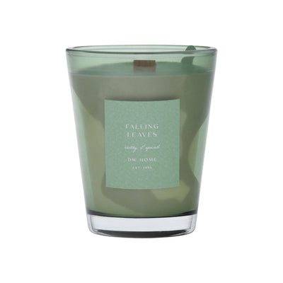 Green vase candle with a label on a green background