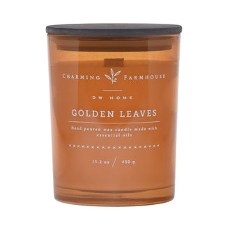 Golden Leaves candle with 'Charming Farmhouse' label on a dark orange background