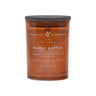 Amber colored candle jar with 'Charming Farmhouse' label on an amber background