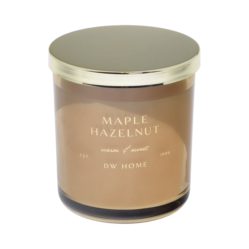 Candle with gold lid and 'Maple Hazelnut' fragrance and 'DW Home' branding