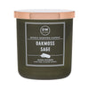 Green candle with a white label on a white background