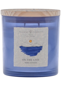 A On the Lake candle with a wooden lid from Charming Farmhouse.