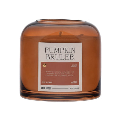 Brown glass candle with 'Pumpkin Brulee' label on a white background