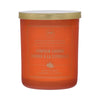 Orange candle with gold lid labeled 'Pumpkin Churro' on a white background