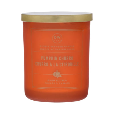Orange candle with gold lid labeled 'Pumpkin Churro' on a white background