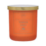Orange candle with a gold lid labeled 'Pumpkin Donut' on a white background