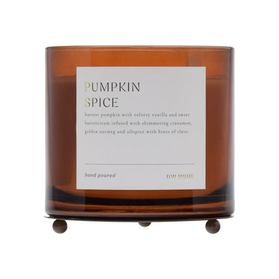 Pumpkin spice candle with a label on a white background